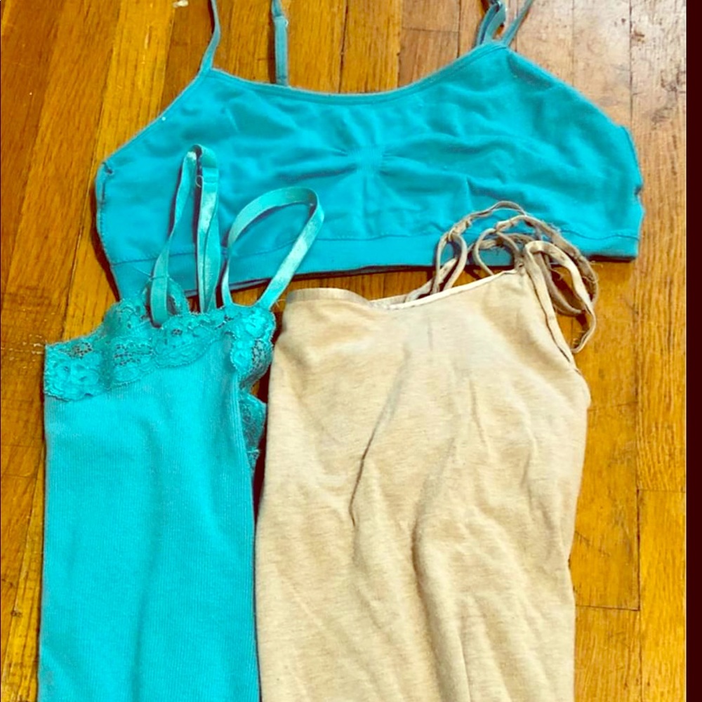 Two tank tops and a sports bra